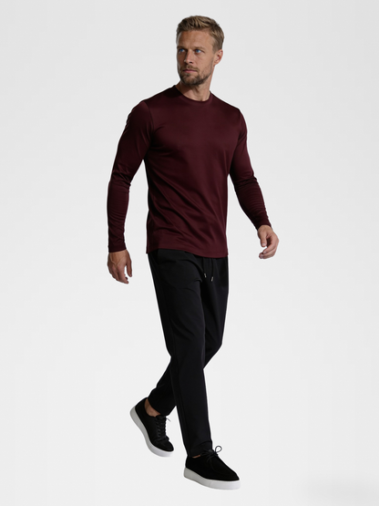 burgundy long sleeve, black urbanpants, black shoe — blond_model — Walking