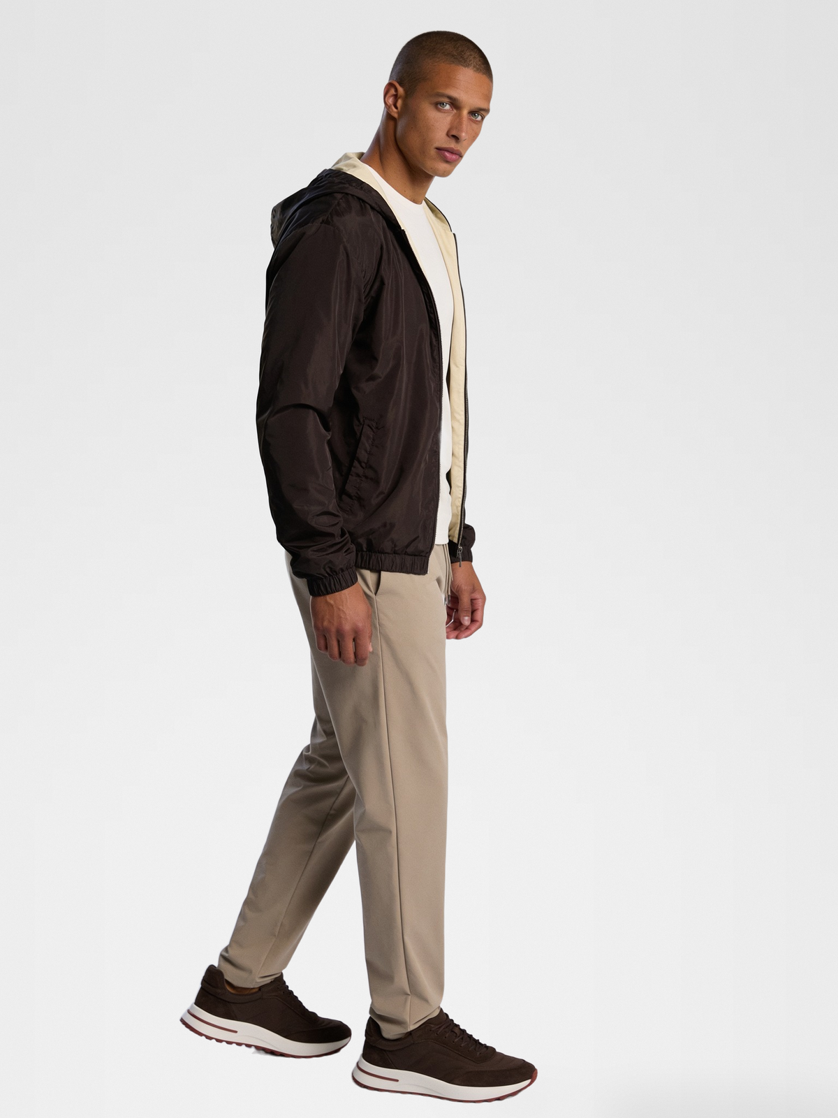 desert sand imperial tee, brown jacket, beige urbanpants, lp brown shoe — lightskin_model — 3/4 Side